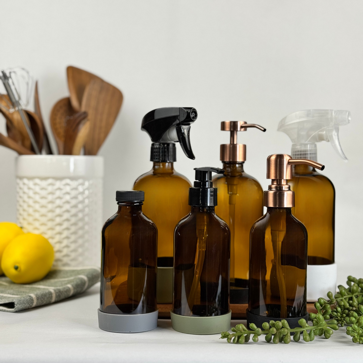 Amber Glass Dispenser with Silicone Sleeve showing available pump, sprayer and cap options