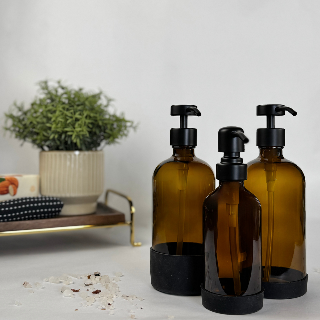 Amber Glass Dispenser with Silicone Sleeve showing pump finish options