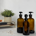Amber Glass Dispenser with Silicone Sleeve showing pump finish options
