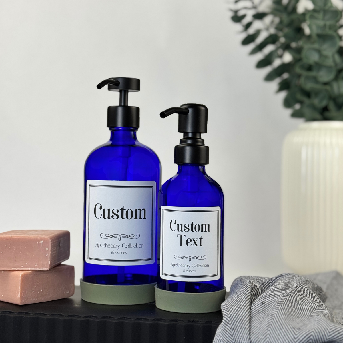 Cobalt blue glass dispenser with silicone sleeve and customizable Apothecary label