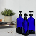 Cobalt blue glass dispensers with white silicone sleeves and black pumps